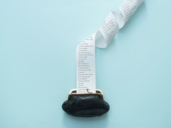 large receipt flowing out of coin purse